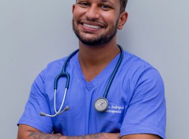 man in blue crew neck t-shirt smiling