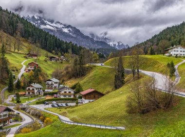 houses on green mountain surrounded with trees