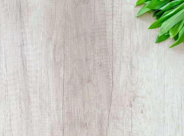 green leafed vegetable on brown wooden surface