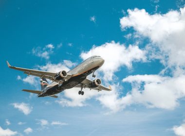 white airplane under blue sky during daytime