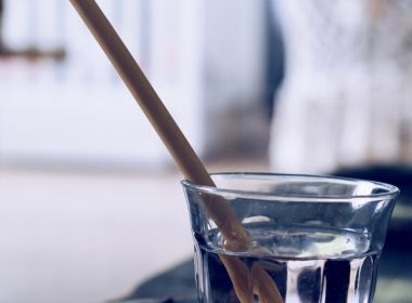 clear drinking glass with brown straw