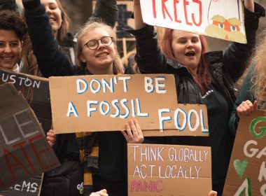 people holding signs