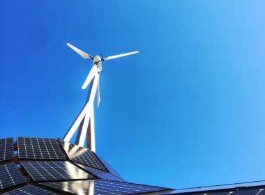 white wind turbine on top of a building