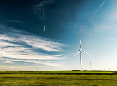 photo of wind turbines on green grass