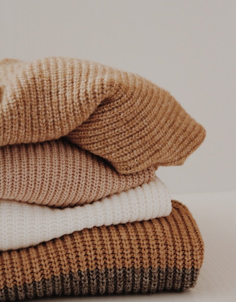brown and white textiles