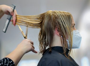 woman in black long sleeve shirt holding microphone