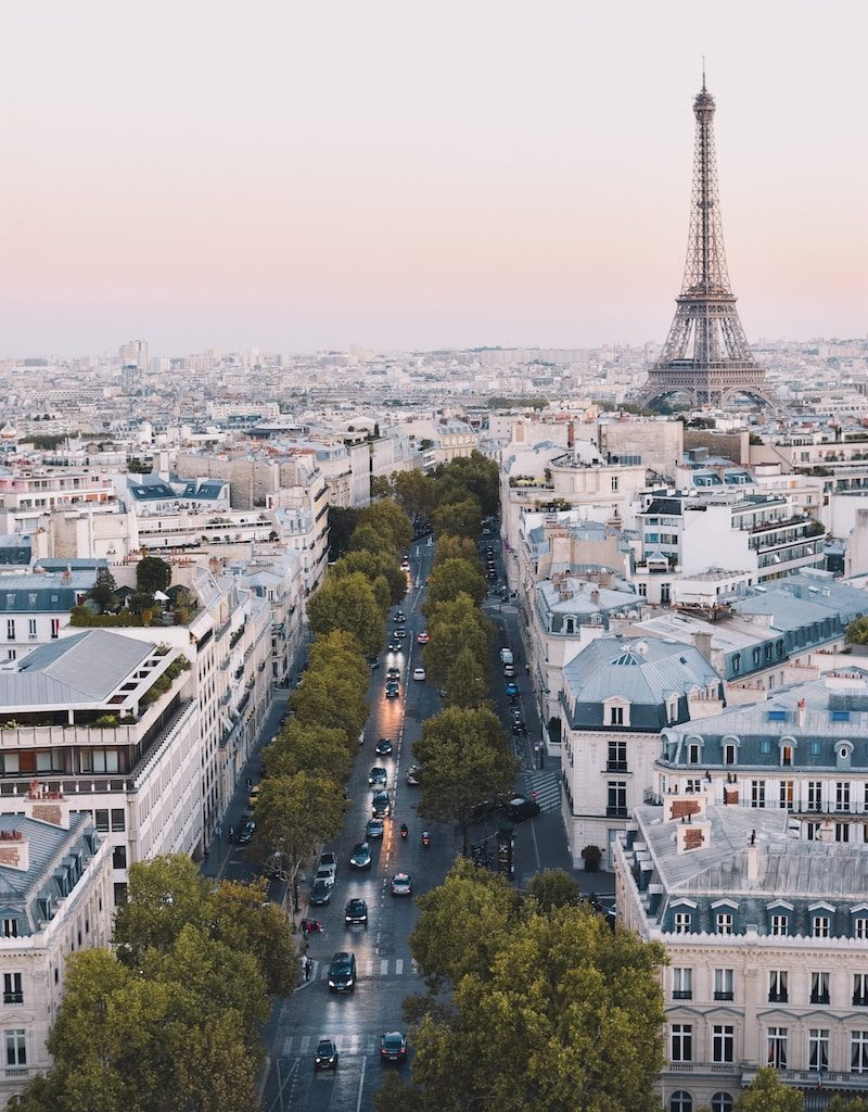 busy street near Eiffel Tower in Paris during daytime