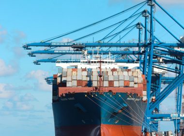a large cargo ship at a dock