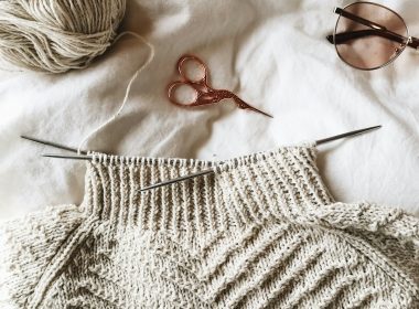 brown framed sunglasses on white knit textile