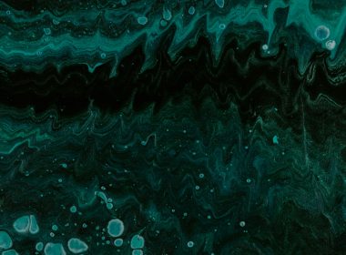a black and green abstract painting with bubbles