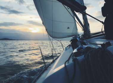 white sailing boat on body of water