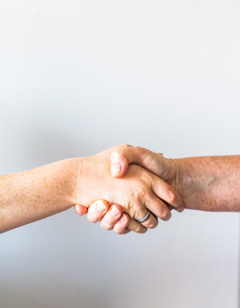 person holding hands of another person