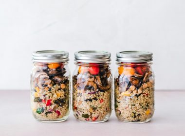 three full clear glass jars with lids