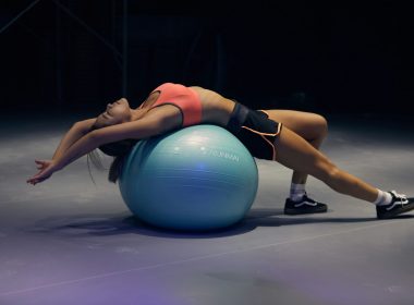 woman doing yoga on stability ball