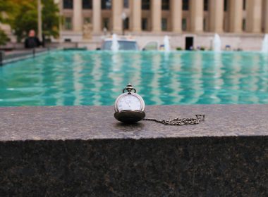 silver pocketwatch on pool