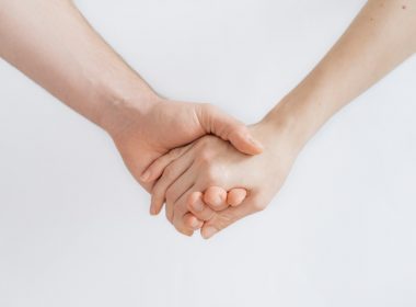 woman and man holding hands