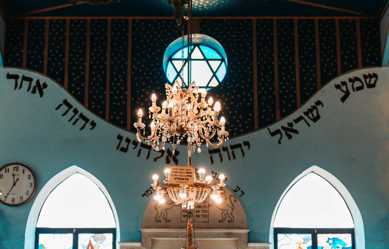 a chandelier hanging from the ceiling of a church