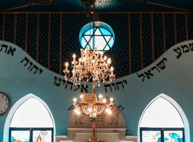 a chandelier hanging from the ceiling of a church