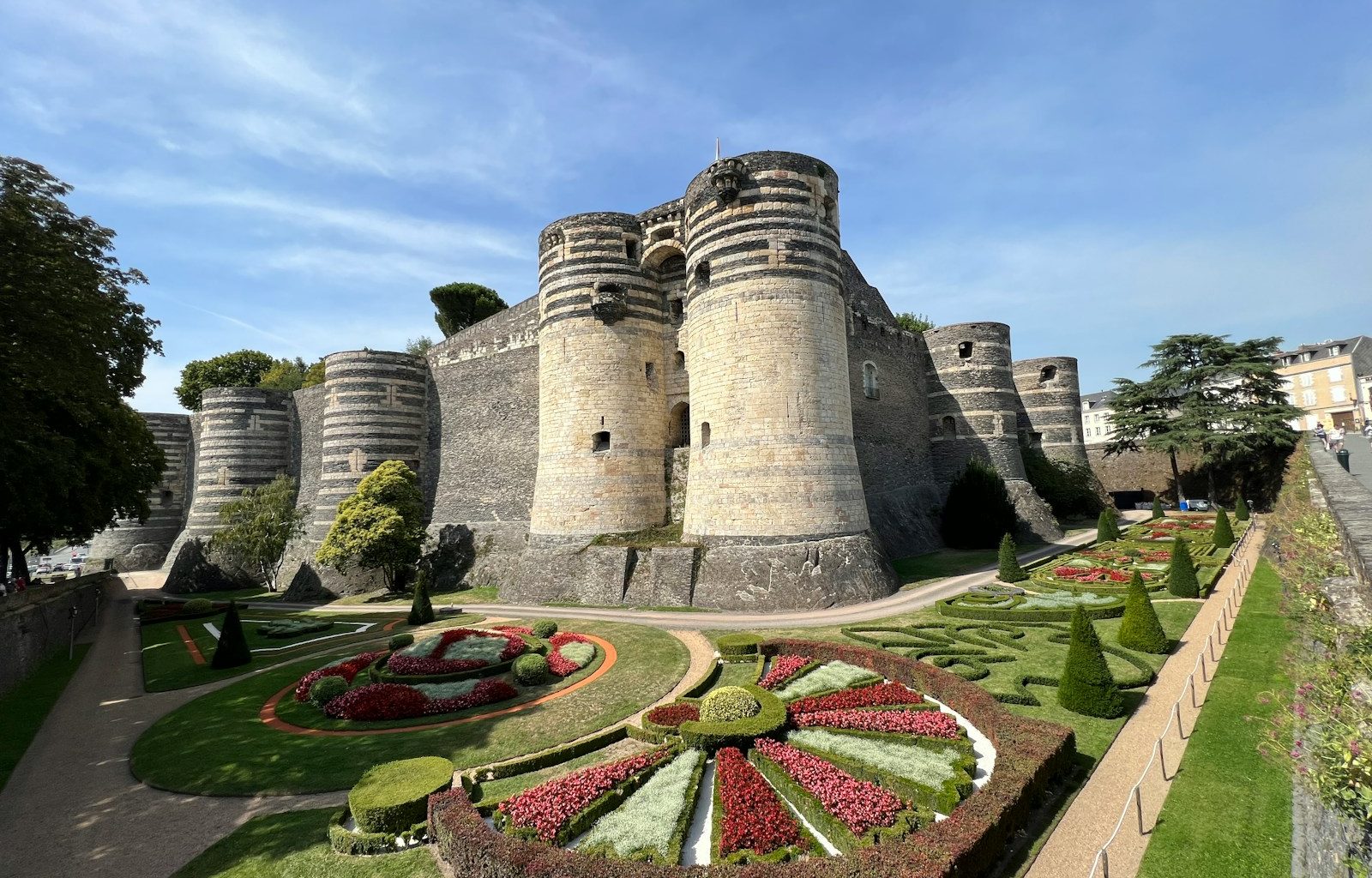 a castle with a garden in front
