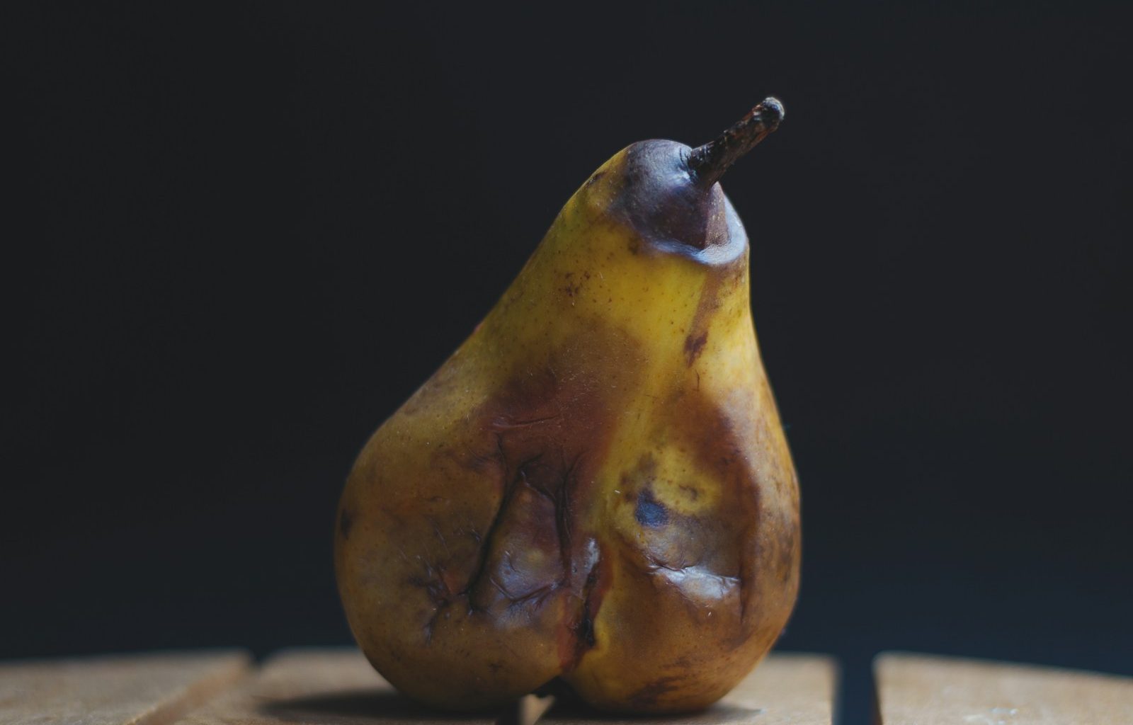yellow fruit on brown wooden table