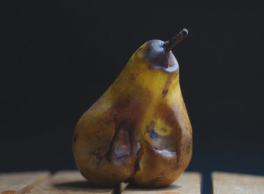 yellow fruit on brown wooden table