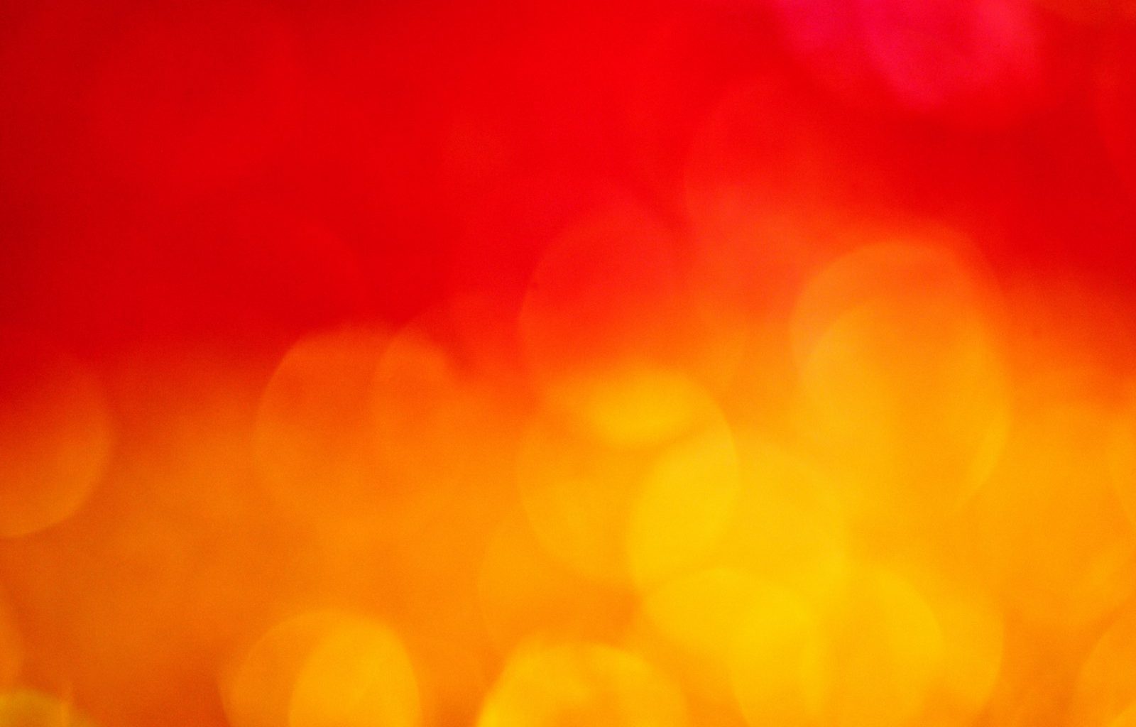 a blurry image of a red and yellow background