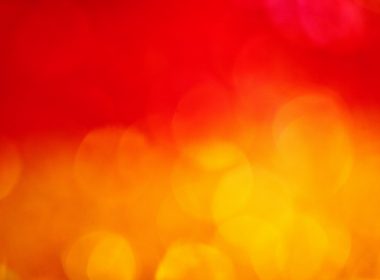 a blurry image of a red and yellow background