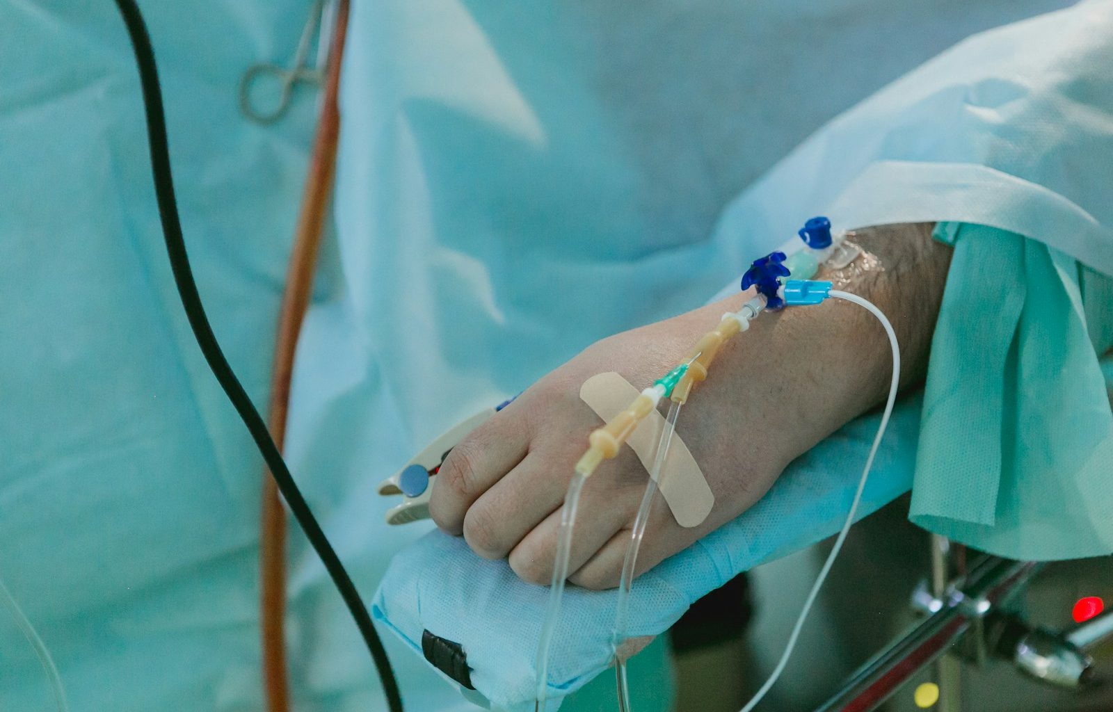a person in a hospital bed with an iv