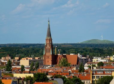 a view of a city with a church steeple
