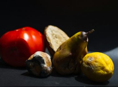 a group of fruits and vegetables sitting on a table