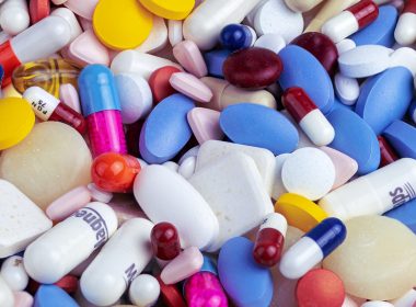 white blue and orange medication pill