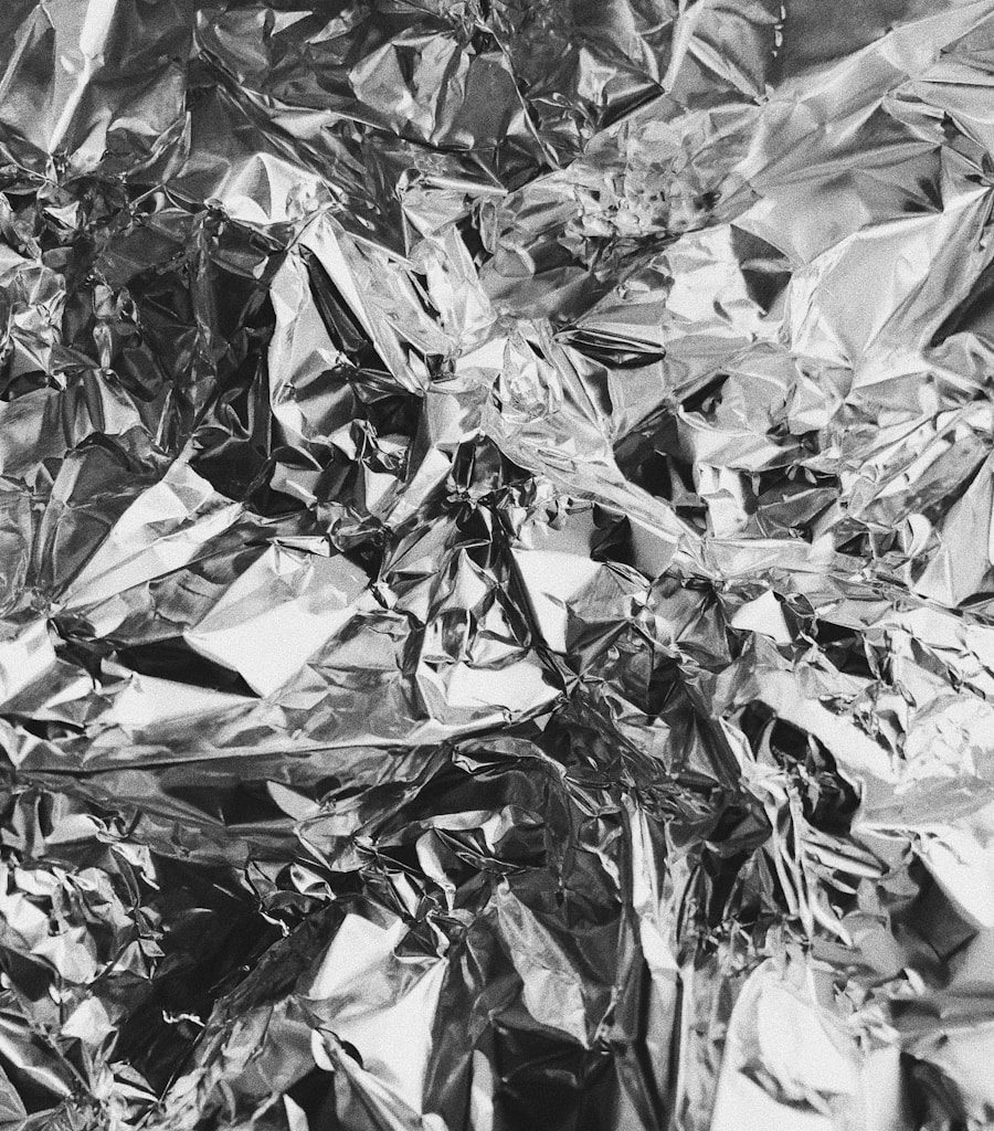 grayscale photo of leaves on ground