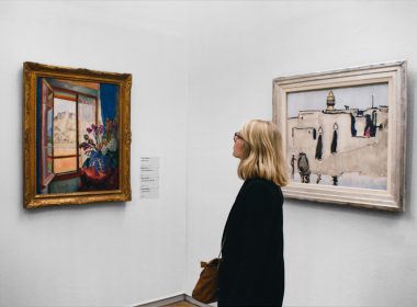 woman looking at painting
