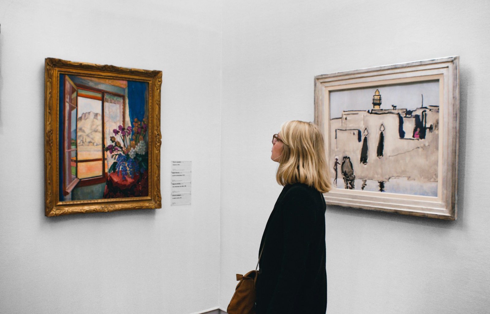 woman looking at painting