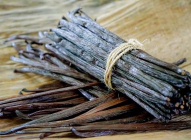a bundle of sticks sitting on top of a wooden table