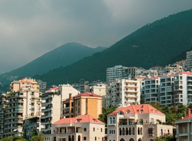 a view of a city with mountains in the background