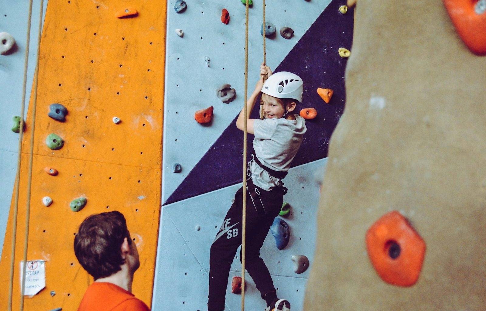 boy doing wall climbing