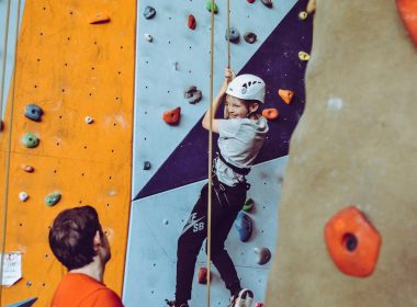 boy doing wall climbing