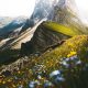 green grass and gray rocky mountain during daytime