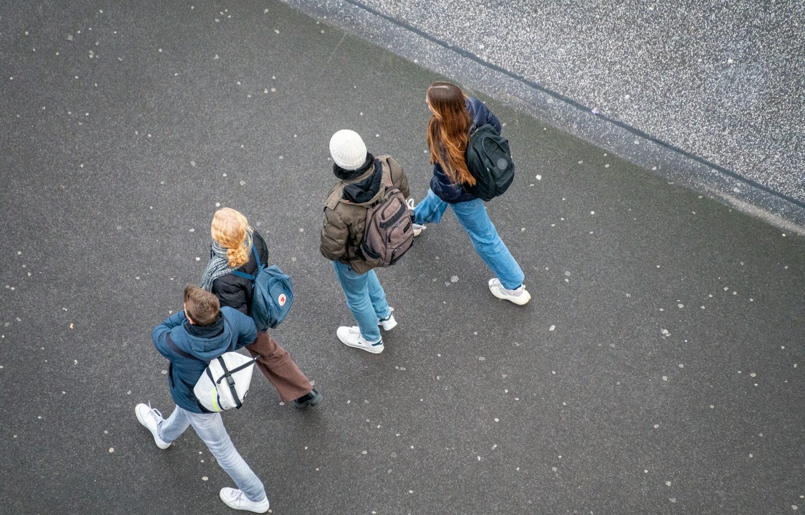 a group of people walking down a street