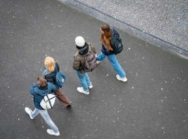 a group of people walking down a street