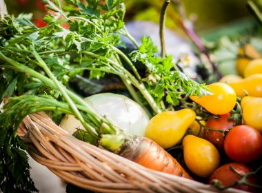 a basket filled with lots of different types of vegetables