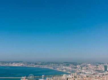 city buildings near body of water during daytime