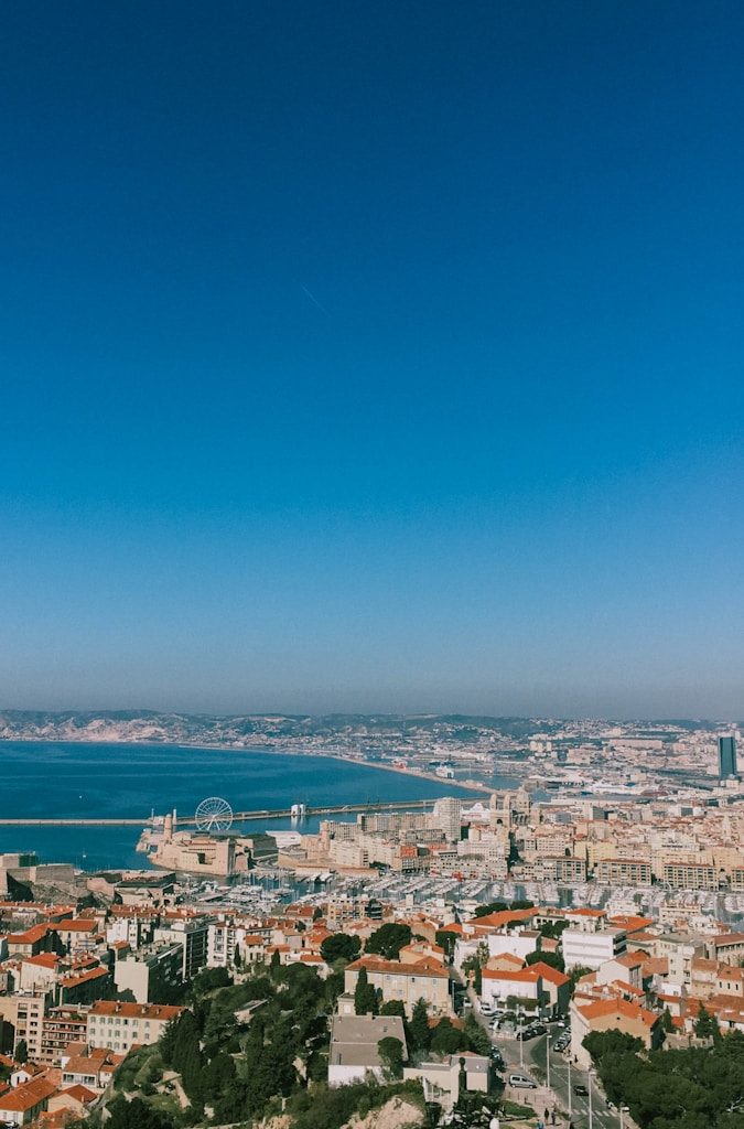 city buildings near body of water during daytime