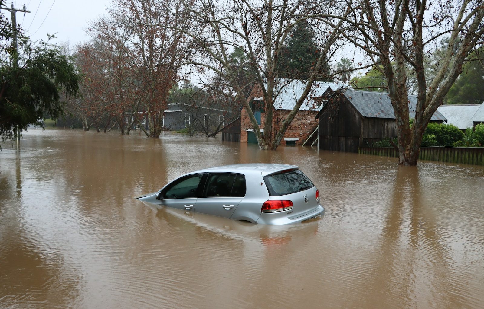 a car driving through a flooded street
