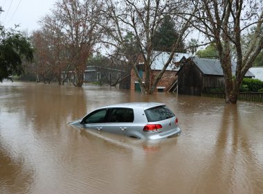 a car driving through a flooded street
