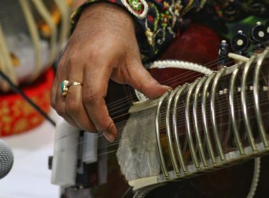 a close up of a person playing a musical instrument