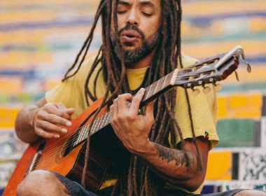 a man playing a guitar