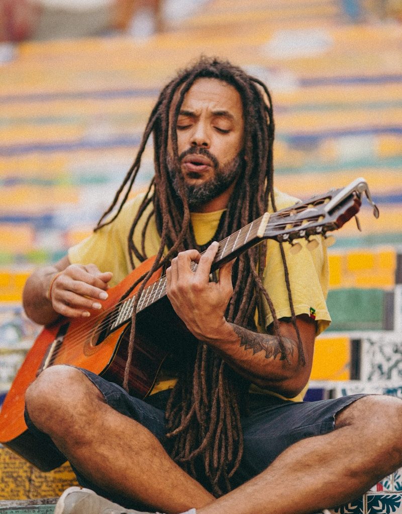 a man playing a guitar