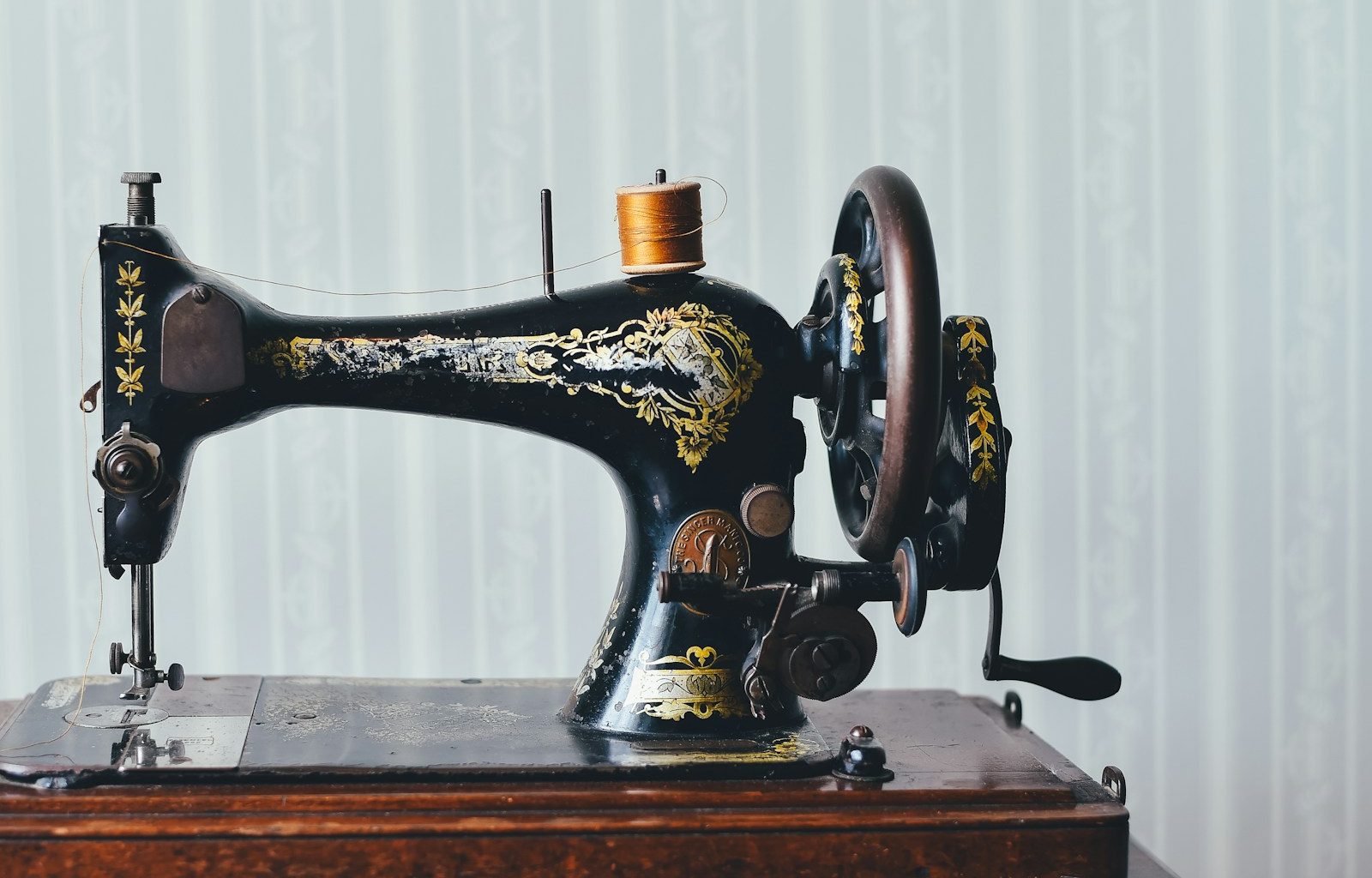 black and yellow metal sewing machine